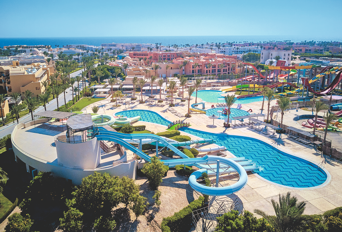 An aerial shot of the Jaz Lamaya hotel, overlooking the facilities with the coastline in the horizon.