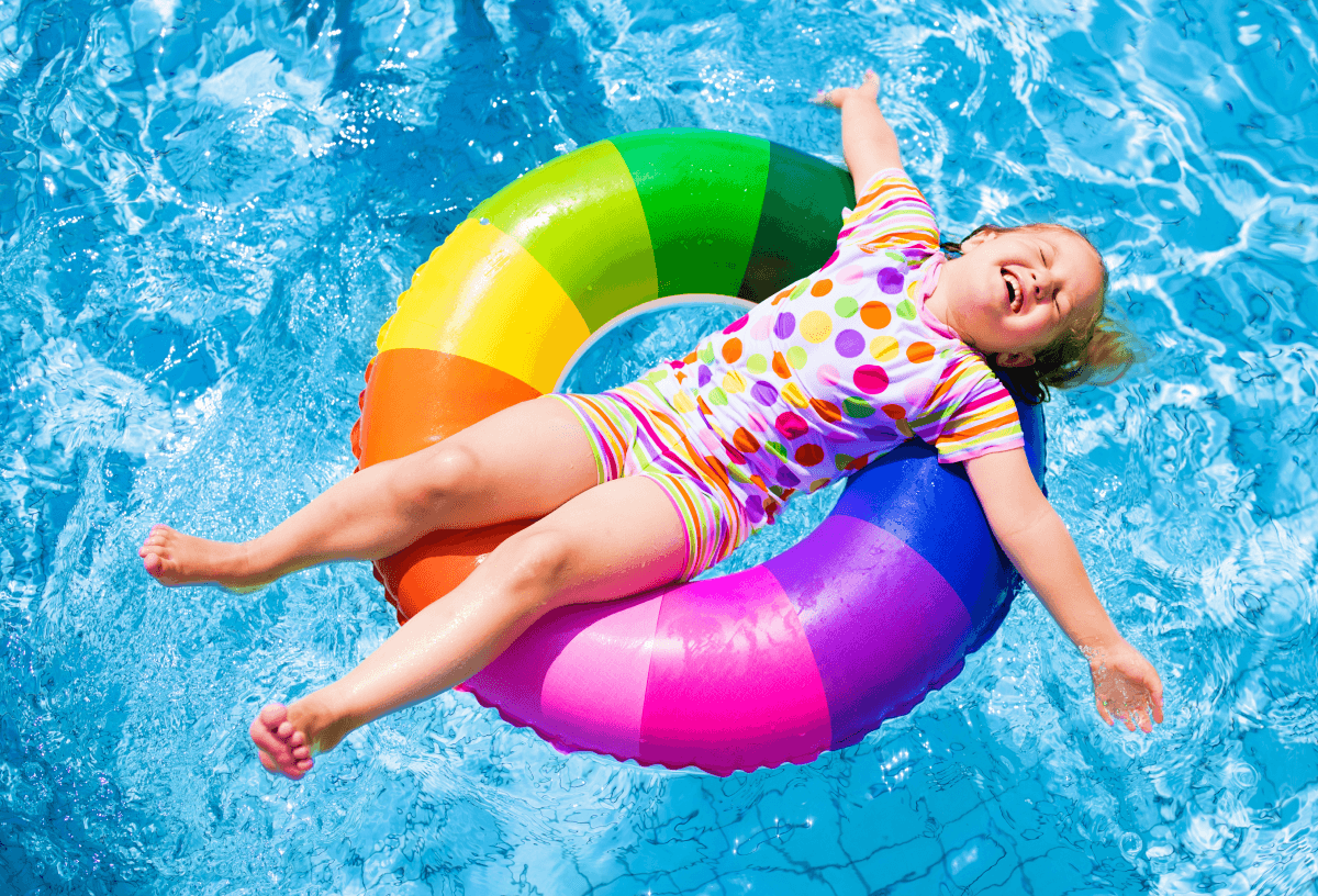Happy child relaxing on pool inflatable