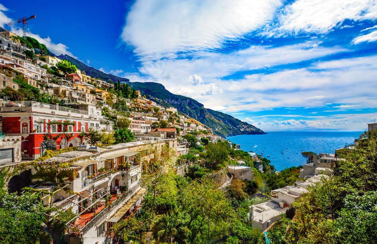 View of the Amalfi Coast with coloured buioldings in the hillside overlooking the ocean