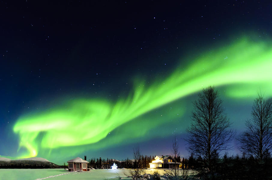 The Northern Lights above a hotel in Lapland