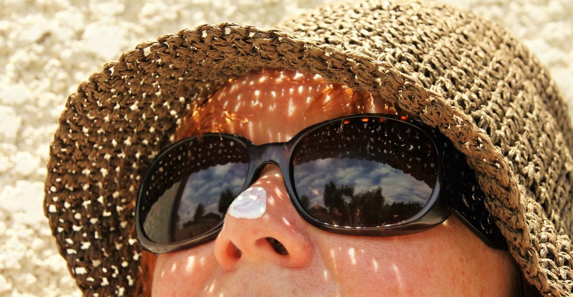 Lady with sun cream on her nose