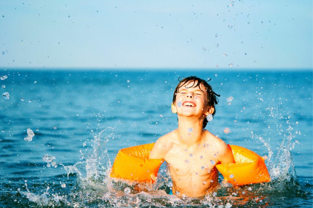 Boy playing in the sea