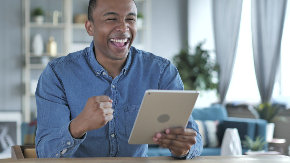 Man excited over using saved bookmarks to find black friday deals