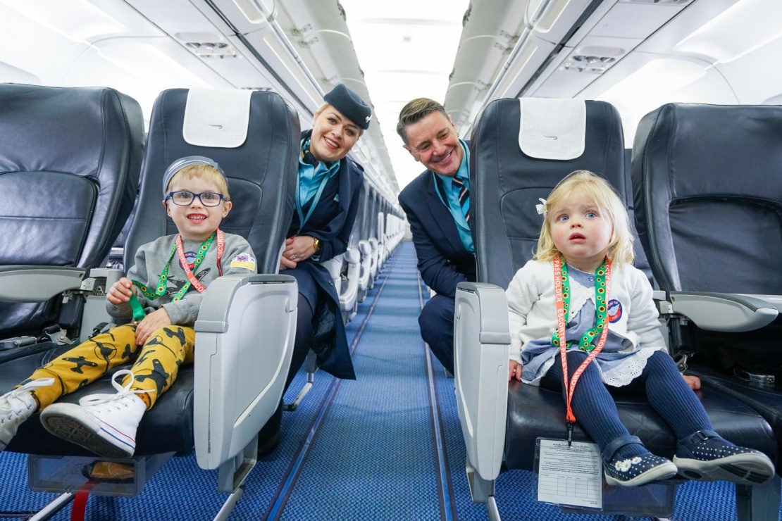 TUI Customers wearing sunflower lanyards on flight