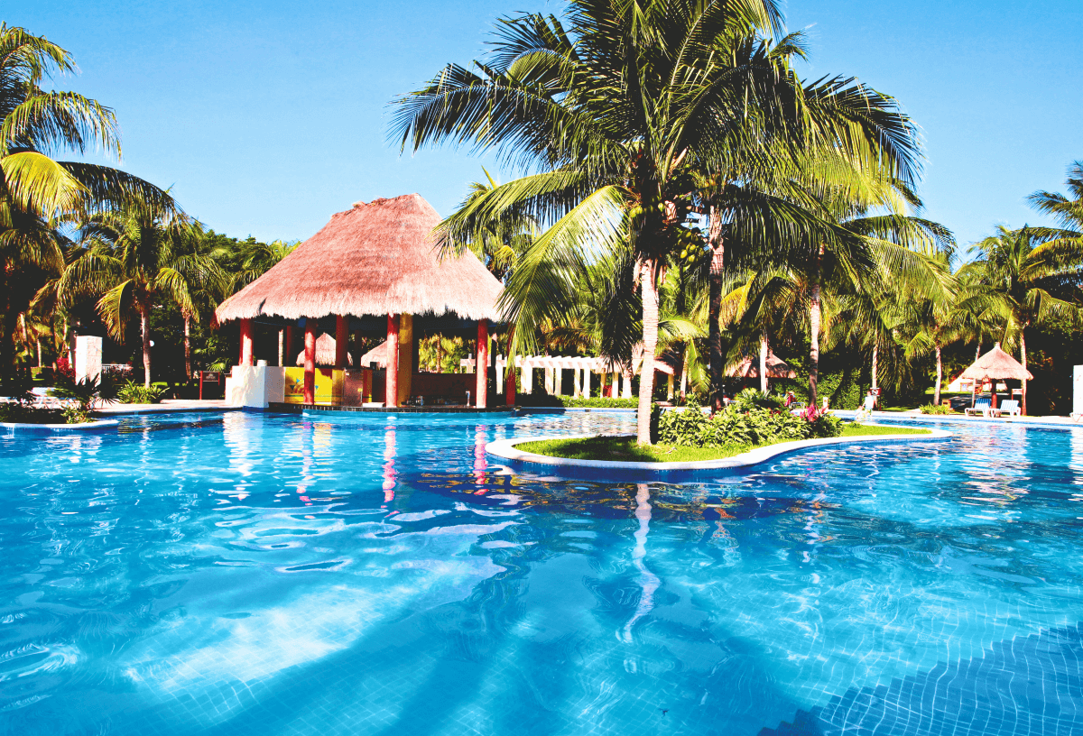 Outdoor pool and swim up bar at the Bahia Principe Grand Coba hotel in Mexico